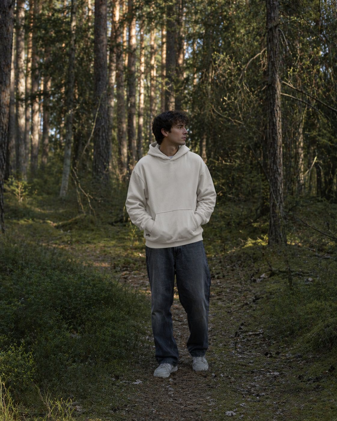 Man wearing Softlly calm hoodie in forest